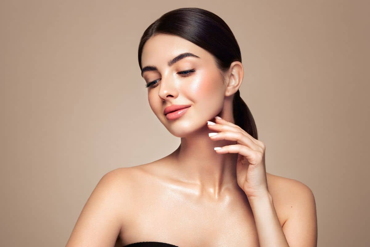 Woman with smooth skin and balanced facial features symbolizing successful rhinoplasty preparation and natural results.