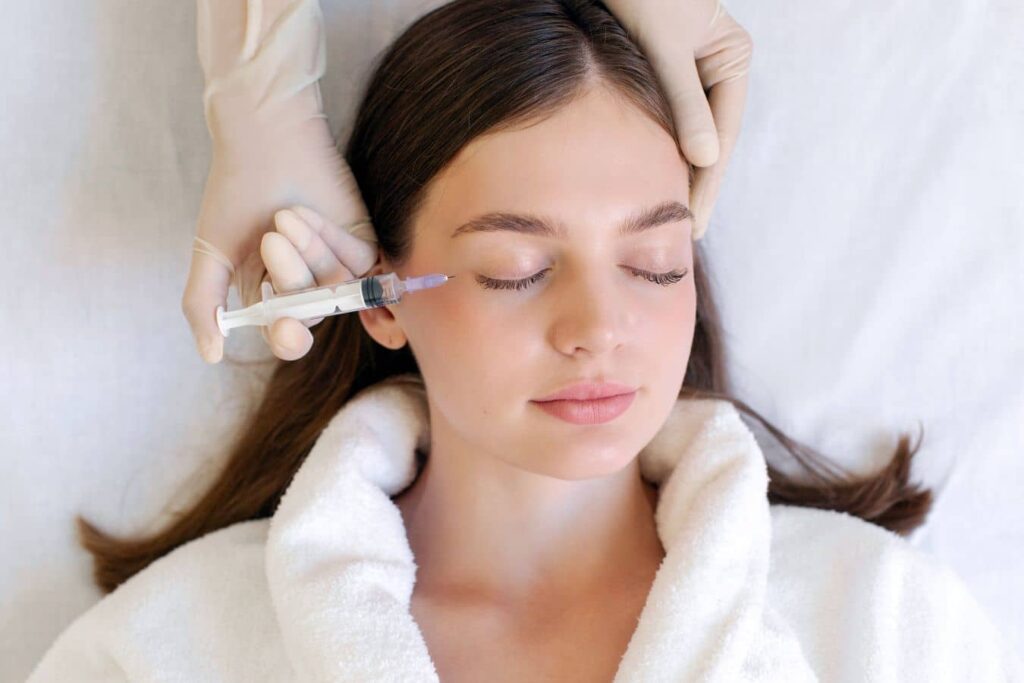 Patient receiving Botox injections near the eyes to reduce crow’s feet and smooth fine lines